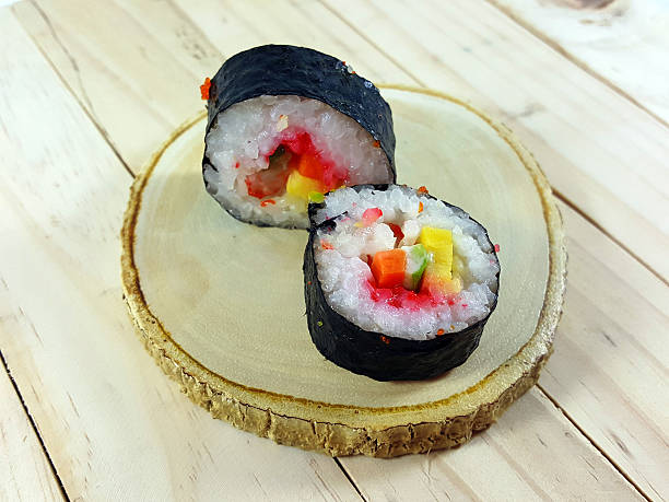 istock Sushi roll on a wood plate. 586373894