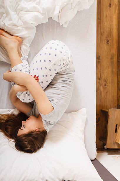 istock Sleepy woman sleeping in the bed. 586375284