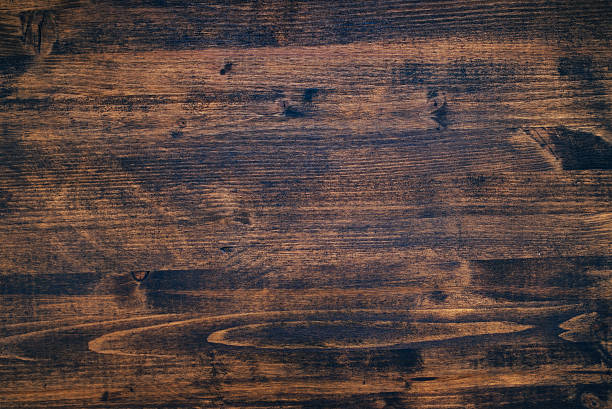 istock Brown painted wooden board texture 586376796