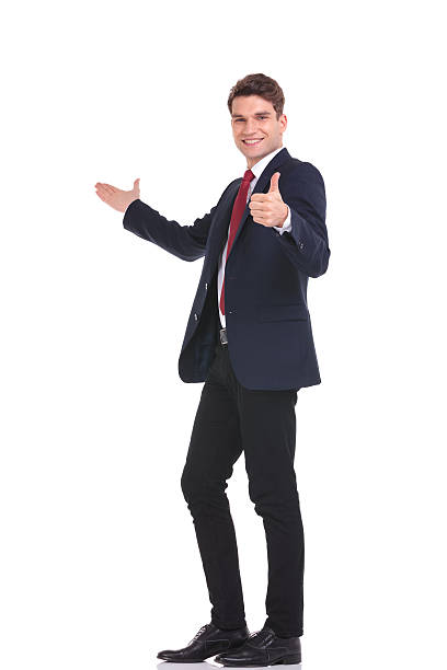 young handsome business man presenting - thumbs up business people isolated imagens e fotografias de stock