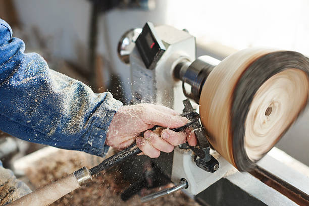 istock man working with woodcarving instruments 586379530