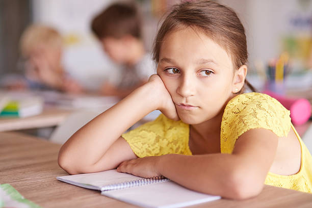 istock Girl bored at the lesson 586379594