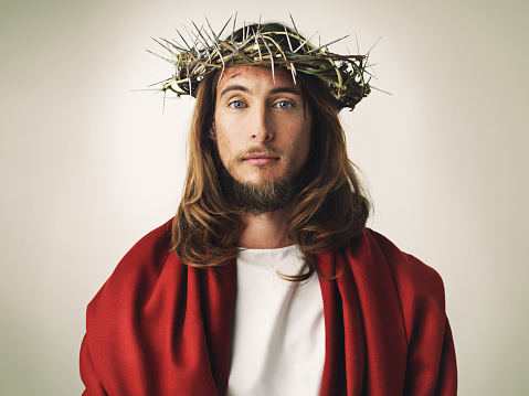 Studio shot of Jesus Christ wearing a crown of thorns