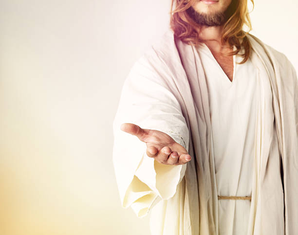 Give me your fear and I’ll give you my hand Cropped studio shot of Jesus Christ extending his arm in assistance jesus christ photos stock pictures, royalty-free photos & images