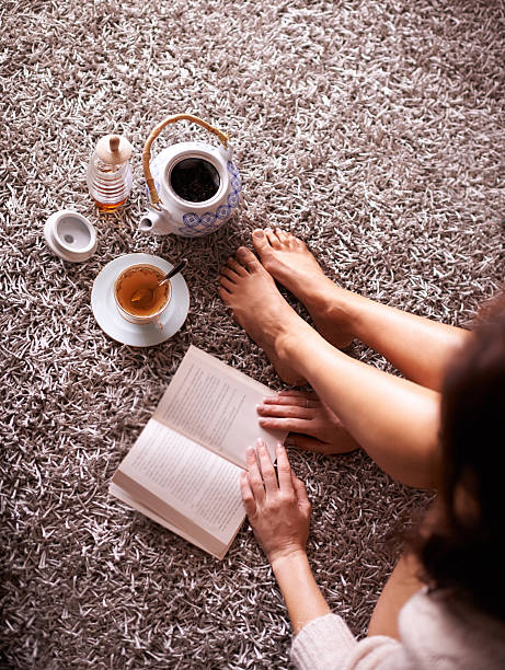 istock All you need is tea and a good book 586383000