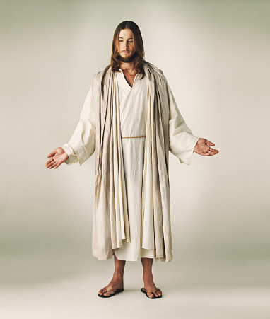Studio shot of Jesus Christ extending his arms