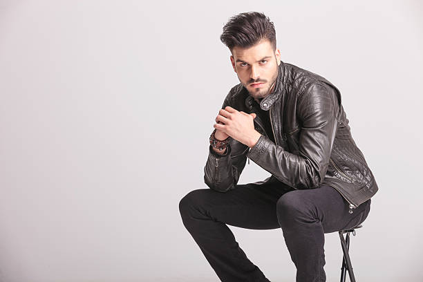 istock handsome casual man holding his hands together 586383906