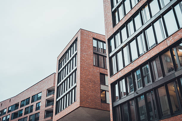 istock Buildings with matching brick and glass features 586384412