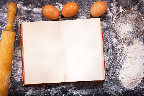 istock Old recipe book with ingredients for cooking 586385560