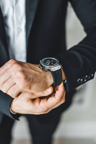istock businessman looking at his watch. 586386504