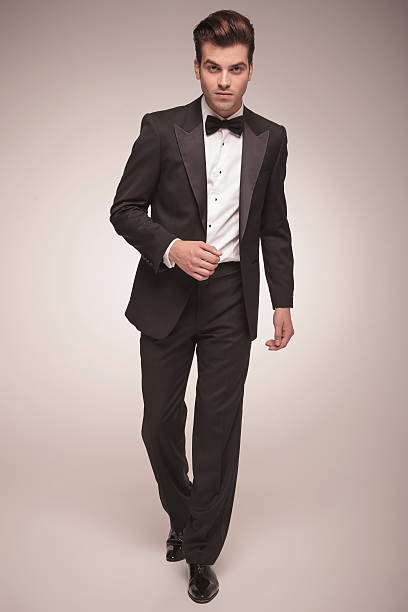 istock handsome young business man walking 586386946