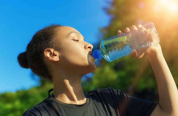 istock Woman drink water after exercise 586389408