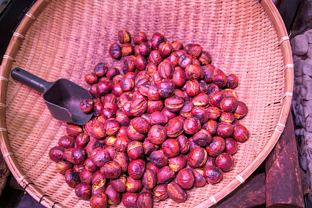 istock grilled chesnut in basket at kyoto japan 586389876