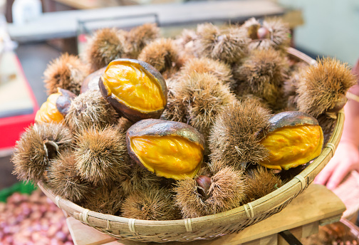 Fresh and ripe rambutan sweet tropical fruit.  Nephelium lappaceum. Selective focus, blurry background.