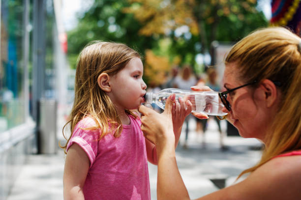 istock Thirsty Cute Little Girl 586391690