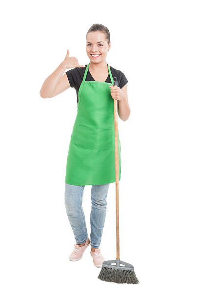 istock Joyful cleaning girl doing a call gesture 586391758
