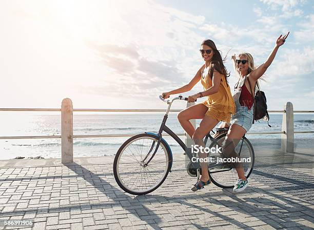 Best Friends Having Fun On A Bike Stock Photo - Download Image Now - Cycling, Friendship, Summer
