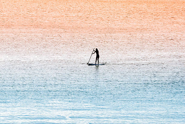 Standup paddle surfer girl stock photo