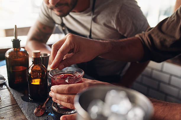 Bartenders experimenting with creating cocktail mixing ideas