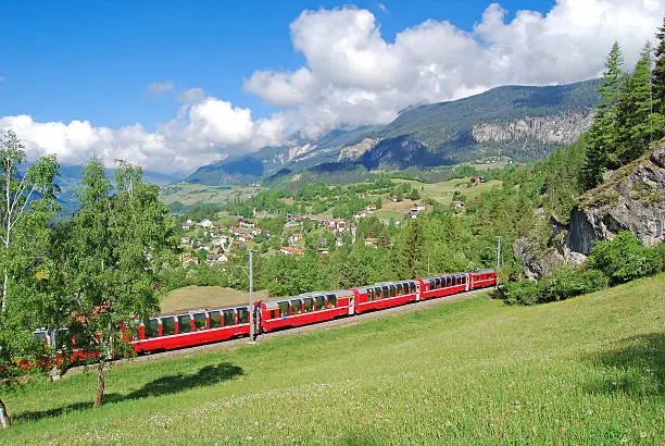 Berninia Express near Filisur on the Albula line. The train is on its way from Chur in the canton of Graubünden along St. Moritz to Tirano (Italy)