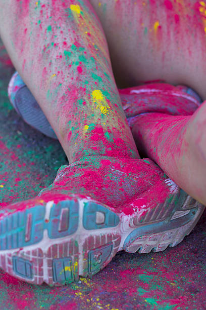 istock Fragment on female leg covered dry paint 586692064