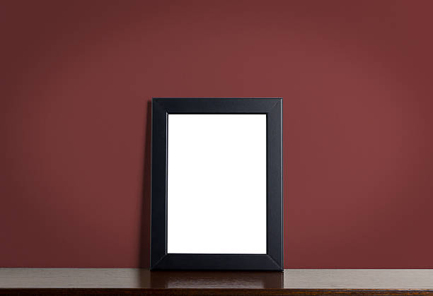 istock Black picture frame border on red classic background. 586692556