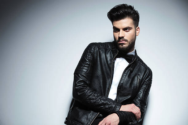 istock handsome business man looking away from the camera 586693108