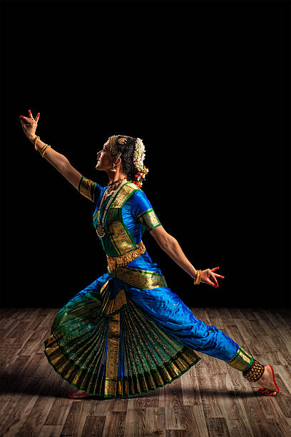 Beautiful woman dancer of Indian classical dance Bharatanatyam Indian culture - beautiful woman dancer exponent of Indian classical dance Bharatanatyam of Tamil Nadu state bharatanatyam dancing stock pictures, royalty-free photos & images