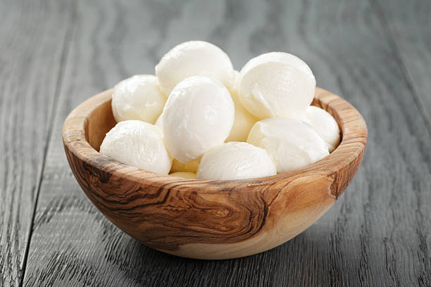 istock small balls of mozzarella in olive bowl with basil 586693306