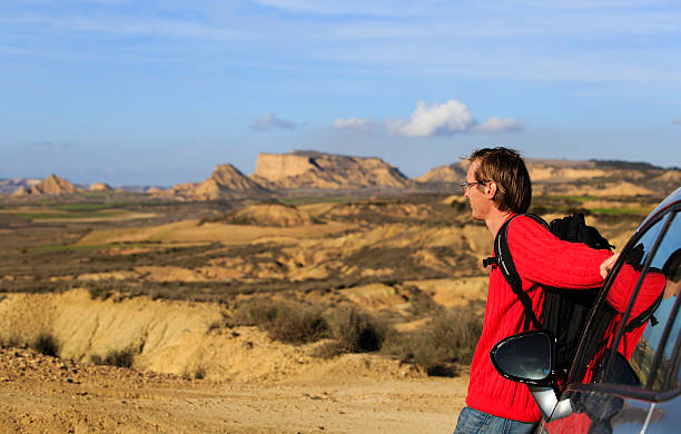 istock young man travel by car in mountains 586694290