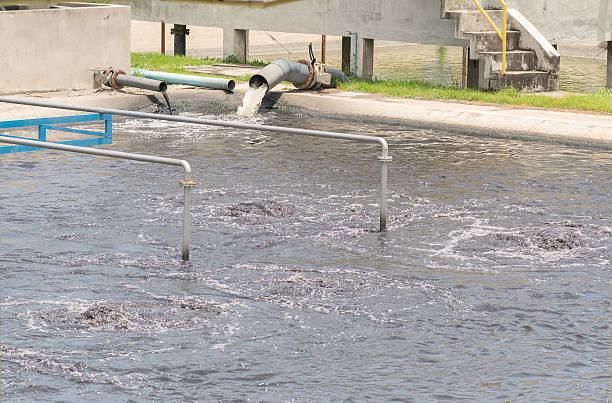 wastewater treatment plant aerating basin. - natural basin imagens e fotografias de stock