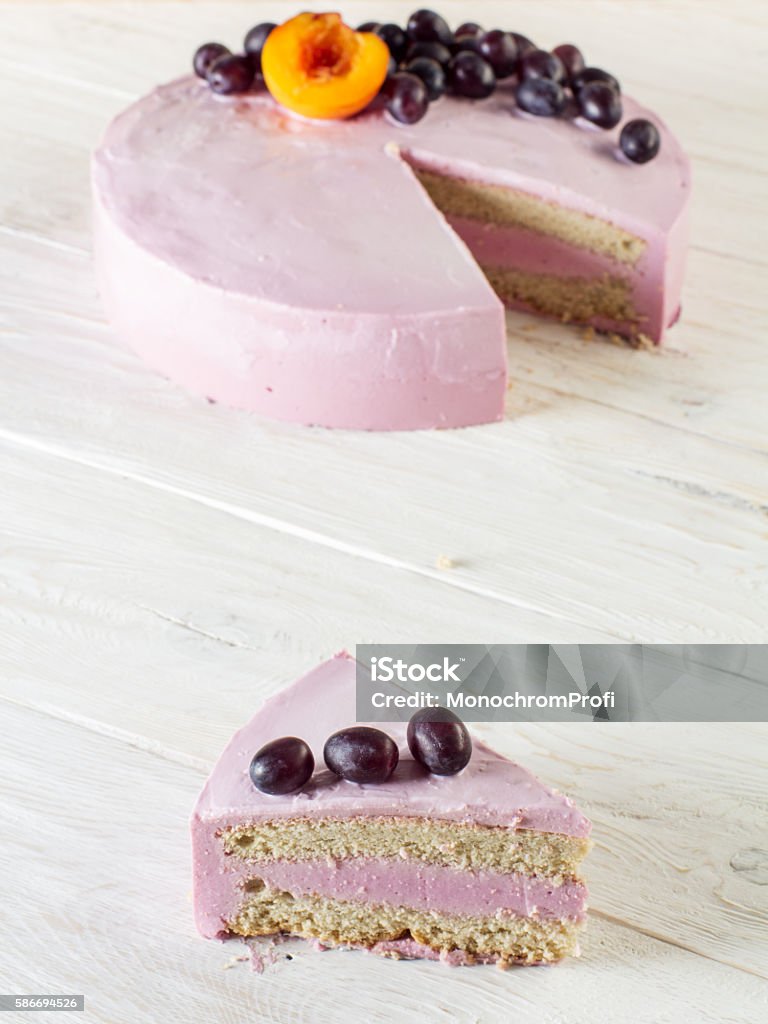 Cut piece fruit cheesecake decorated with grapes Cut piece fruit cheesecake decorated with grapes. Closeup Berry Fruit Stock Photo
