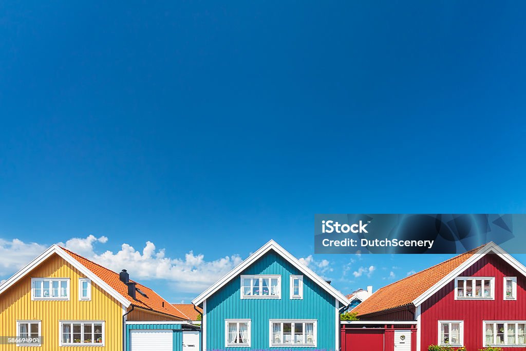 Old swedish houses in front of a blue sky Colorful old swedish houses in front of a blue sky House Stock Photo