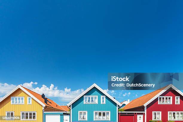 Old Swedish Houses In Front Of A Blue Sky Stock Photo - Download Image Now - House, Multi Colored, Sweden