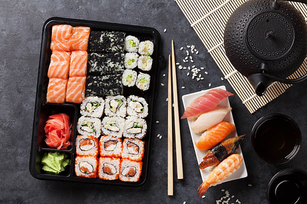 istock Set of sushi, maki and green tea 586695500