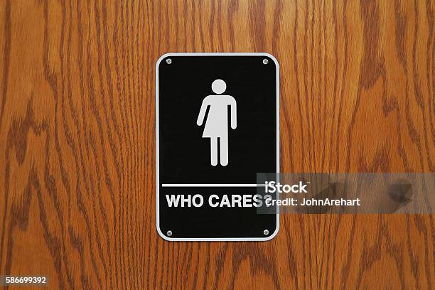 Gender Neutral Restroom Sign That Says Who Cares Stock Photo - Download Image Now