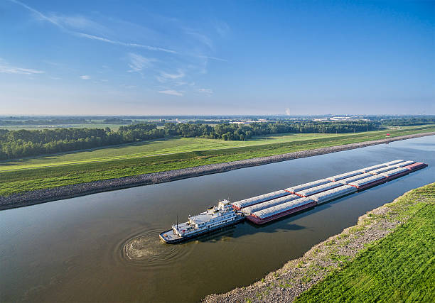 Chain of Rocks Canal barges on Chain of Rocks Canal of MIssissippi River above St Louis - aerial view barge stock pictures, royalty-free photos & images