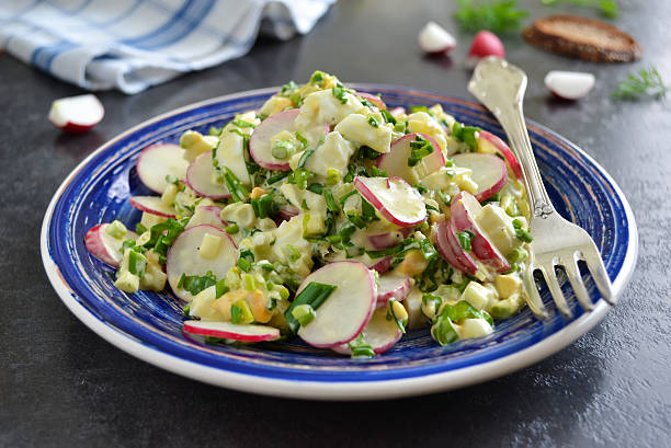 istock salad with radish, egg and wild garlic 586702532