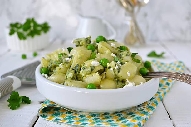 istock pasta with cheese, spinach and green peas 586704322