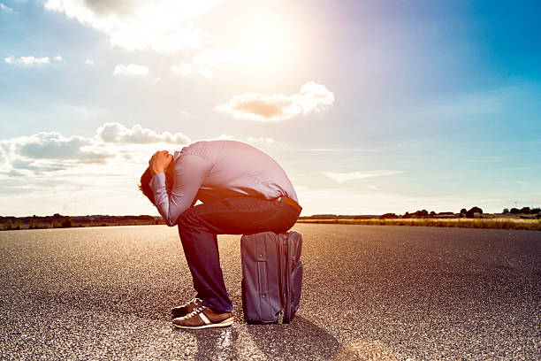 istock Exhausted passenger is stranded and waits impatiently for airplane 586704608