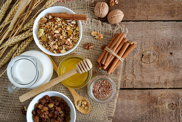 istock Walnuts, granola, milk and honey on wooden background 586706664