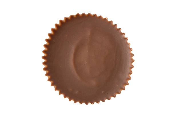 Peanut Butter Cup - Overhead A single peanut butter cup chocolate viewed from straight overhead. peanutbutter stock pictures, royalty-free photos & images