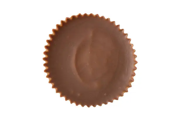 A single peanut butter cup chocolate viewed from straight overhead.