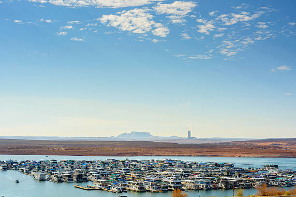 Lake Powell Lake Powell at Wahweap Marina with Navajo Generation Station in the background  Page Arizona gunsight butte stock pictures, royalty-free photos & images