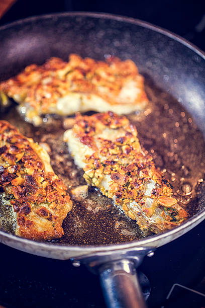 istock Preparing Fresh Alaska Pollock Fillet 586708324