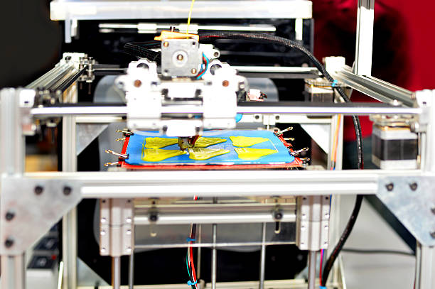 istock Detail of a 3D printer printing an object 586710730