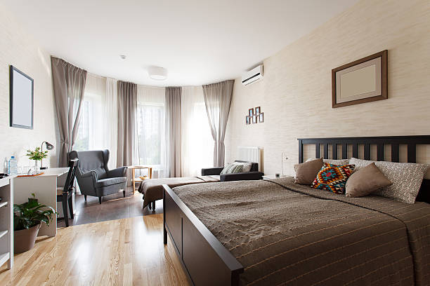 istock Scandinavian bedroom with large window 586711046