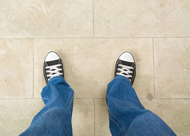 istock Feet on the cobblestone. 586711572