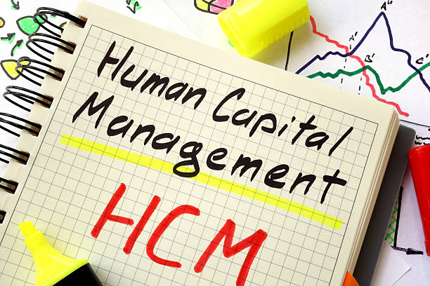 Sign human capital management HCM on a page of notebook.