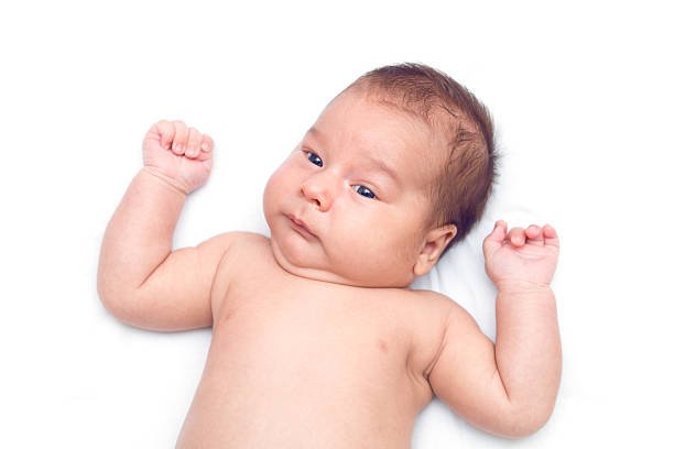 istock infant baby laying on white background 586713166